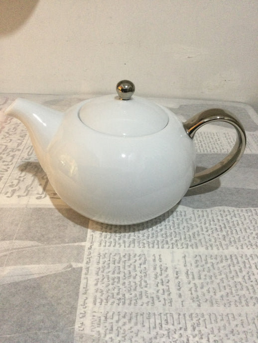 Silver handle tea pot