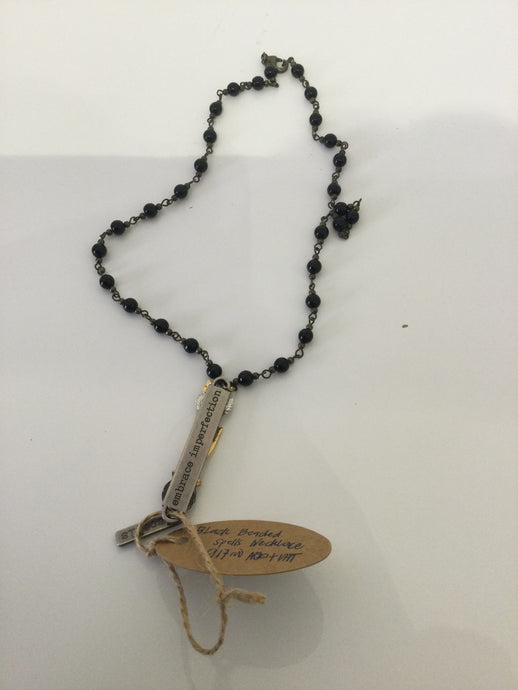 LACK BEADED SPELLS NECKLACE